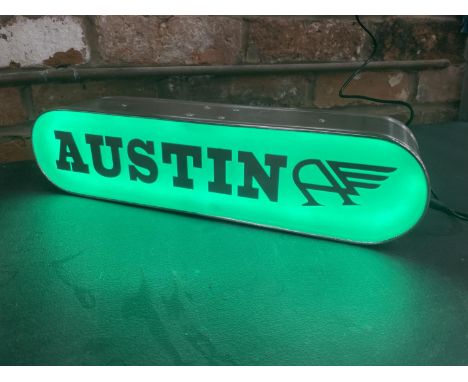A AUSTIN ILLUMINATED LIGHT BOX SIGN - WORKING ORDER AT TIME OF CATALOGUING.  WIDTH 44CM, HEIGHT 10.5CM, DEPTH 10CM 