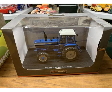 A UNIVERAL HOBBIES MODEL TRACTOR FORD TW 304X4 1:32 SCALE ITEM NO 4023 