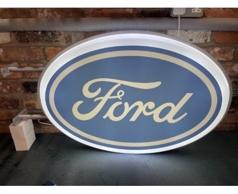 A FORD DOUBLE SIDED ILLUMINATED LIGHT BOX SIGN WITH BRACKET - WORKING ORDER AT TIME OF CATALOGUING.  WIDTH 93CM, HEIGHT 56CM,
