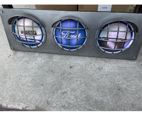 A FORD RS2000 ILLUMINATED LIGHT BOX SIGN WITH THREE IMAGES IN SEPERATE HEADLIGHT DESIGN- WORKING ORDER AT TIME OF CATALOGUING