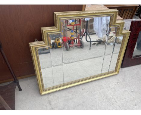 A GILT FRAMED WALL MIRROR, 38" X 30" 