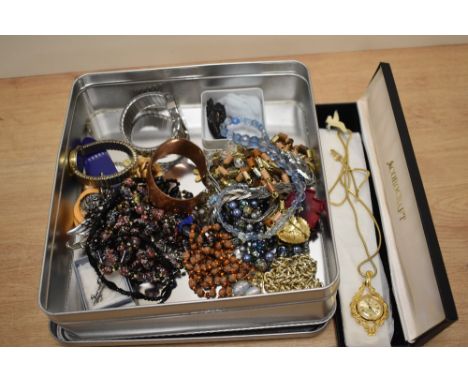 An interesting assortment of ladies costume jewellery, to include a Swiss movement Corocraft watch, a copper bangle, a vintag