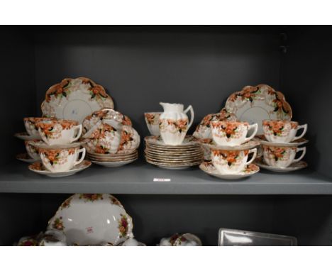 An early 20th century Melba part dinner service, decorated in the Imari pattern, to include cups, saucers, plates, milk jug e