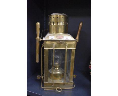 A vintage brass nautical cargo oil lantern with glass chimney, manufactured by Shepperton of England, h40cm.