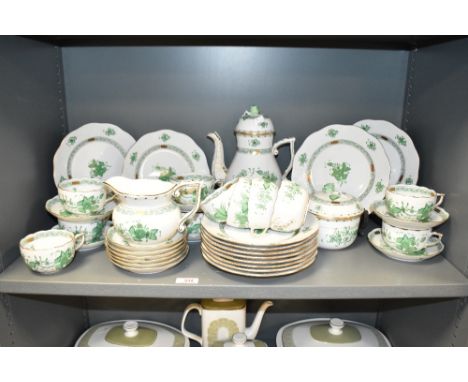 An early 20th century Herend porcelain tea set, hand painted in the Chinese bouquet pattern, having apponyi green colour foli