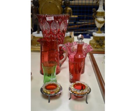 A large vintage crystal ruby overlay vase, having clear to cut floral pattern, h27cm, sold alongside a cranberry style pitche