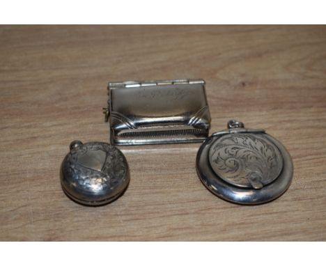 A George V silver sovereign holder, of circular form having floral decoration with a vacant shield cartouche, marks for Birmi