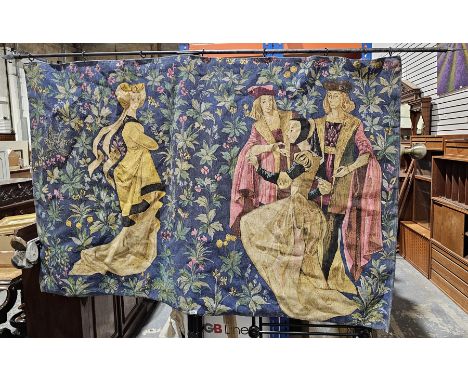 Hessian backed printed tapestry style wall hanging, depicting figures in historical dress on a blue foliate ground, suspended