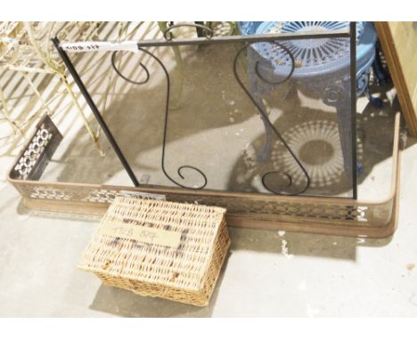 Cast-iron fire screen, a metal fender pierced with ovolos, probably steel (corroded) and a wicker picnic basket, the first 77