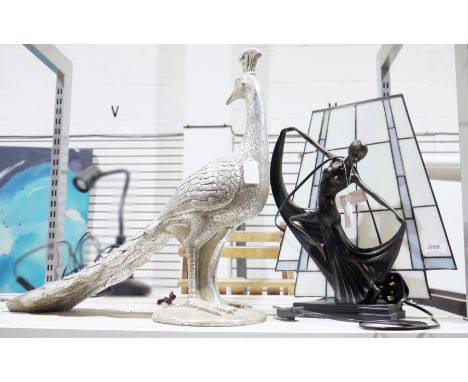 Lamp in the form of an Art Deco dancer in front of a swag glass panel and a silvered resin model of a peacock (2)&nbsp;