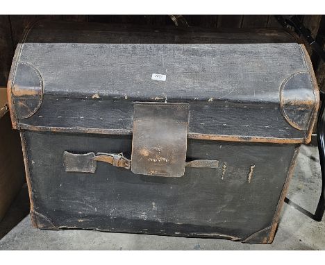 Vintage domed black leather bound travelling trunk, with lock and carrying handles, initialled ILH to lid, enclosing assorted