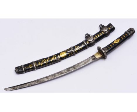 A JAPANESE MINATURE COURT TACHI with floral katakiri decorated silver mounts, the scabbard being black lacquer with gold scro