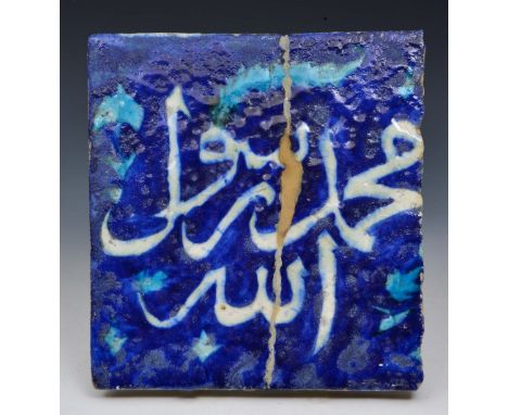 AN ISLAMIC COBALT BLUE GROUND TILE with Nastaliq script, 17th/18th Century