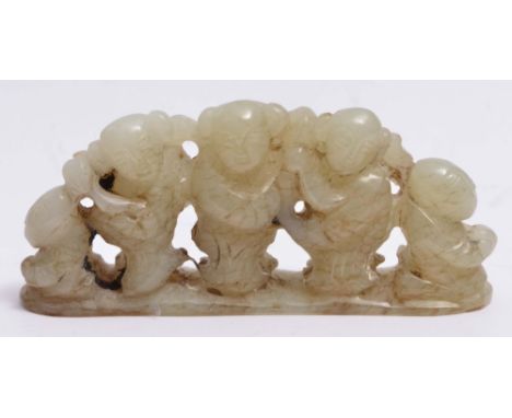 A CELADON JADE SCROLL WEIGHT carved as three youths, 19th Century, 8cm wide