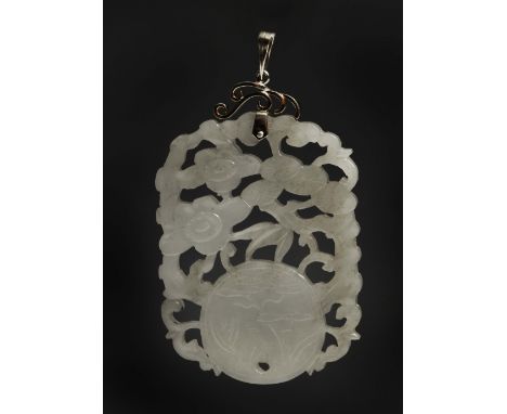 A CHINESE MUTTON FAT JADE PENDANT carved openwork and relief with symbolic plum, pine and a Shou character and pine tree on a