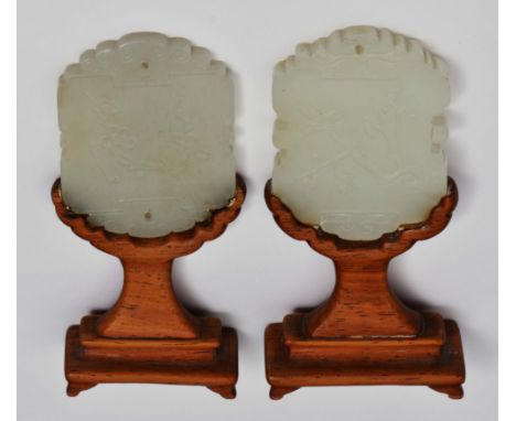 A CHINESE MUTTON FAT JADE SQUARE SIDED PLAQUE FORM pendant with scroll work top and bottom decorated with panels of flowering