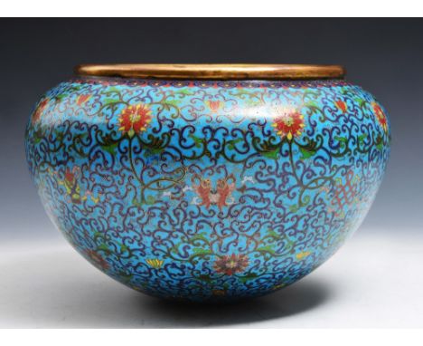 A CHINESE CLOISONNE ENAMEL ROUNDED FOOTLESS BOWL decorated with eight Daoist emblems against a background of Indian lotus and