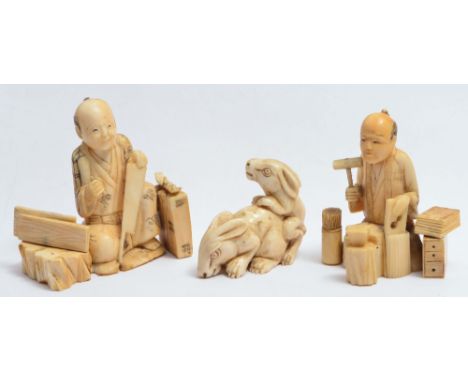TWO JAPANESE SMALL SECTIONAL OKIMONOS, a box maker and carpenter, and a netsuke in the form of two hares (3)