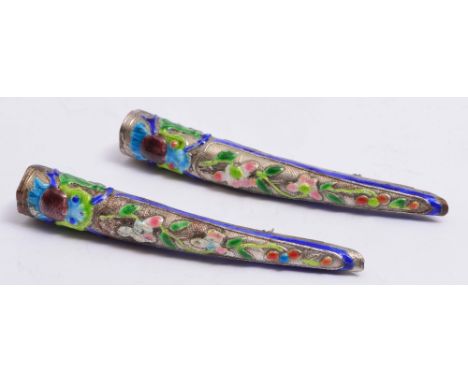 A PAIR OF CHINESE FINGER EXTENSIONS with polychrome floral enamel decoration,9cm long