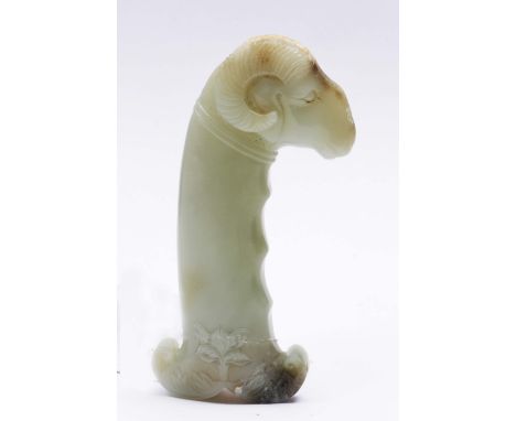 A CHINESE WHITE JADE MUGHAL STYLE SWORD OR DAGGER HANDLE carved with a horned ram's head, base with stylised lotus flower and
