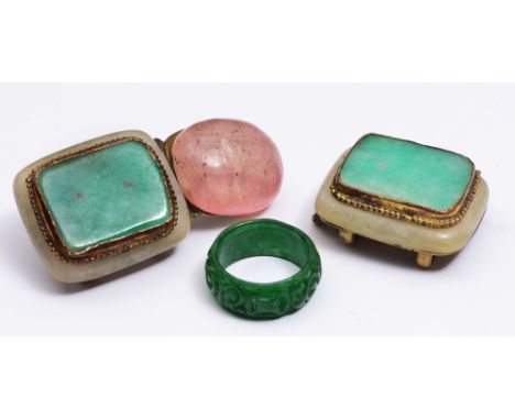A CHINESE SPINACH JADE CARVED RING and a Chinese jade mounted buckle, late 19th Century (2)