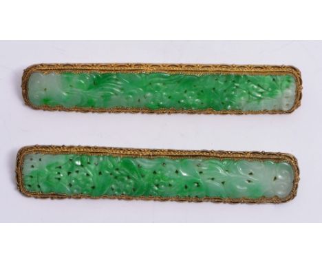 A PAIR OF CHINESE GILT BAR BROOCHES with filigree decoration and carved jade setting, 8.5cm