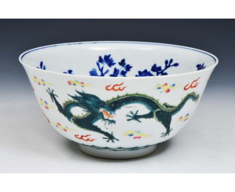 A CHINESE CERAMIC POLYCHROME BOWL, decorated with two five clawed dragons to the exterior and blue and white floral motifs to