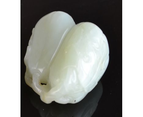 A CHINESE WHITE JADE LOQUAT GROUP, the two fruits hanging from a branch, 18th/19th Century, 5.5cm