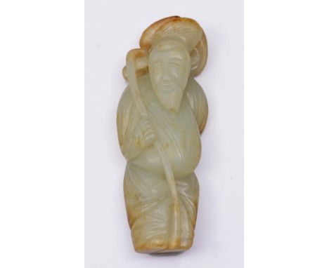 A CHINESE WHITE AND RUST SPLASH JADE FIGURE OF A STANDING IMMORTAL holding a staff, 18th/19th Century, 11.9cm high