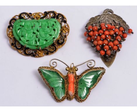 A CHINESE GILT BROOCH in the form of a butterfly with jade and coral setting, a Chinese jade brooch with filigree and enamel 