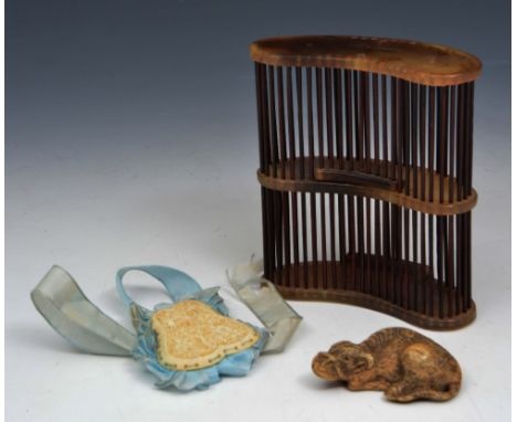 A CHINESE HORN CRICKET CAGE, an ivory pendant and a netsuke in the form of a water buffalo (3)