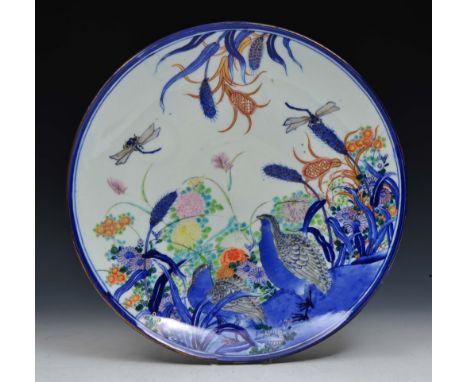 A JAPANESE FUKAGAWA CHARGER with underglaze blue decoration of quails, dragonflies and chrysanthemums with polychrome enamel 