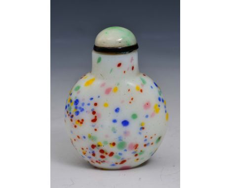 A CHINESE GLASS SNUFF BOTTLE with flecked multi-coloured decoration on a white ground with mottled jade stopper, 6.5cm high