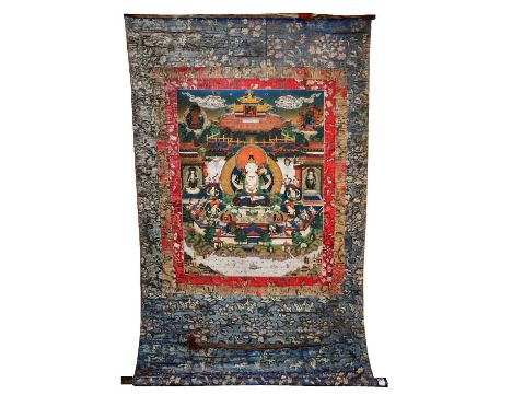 A CHINESE TIBETAN THANKA PAINTING depicting a central buddha in a traditional buddhistic pantheon setting within three silk b