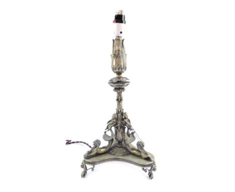 A Victorian EPNS table lamp, on tripod base, with raised decoration of putti and seahorses, converted from an epergne, 50cm h