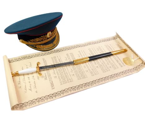 A Soviet Union cap, with applied gilt ribbon band and embroidered on green material and a Wilkinson Sword Collection of Liber