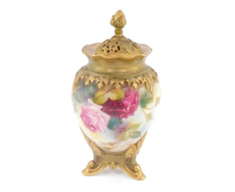 A late 19thC Royal Worcester jar and cover, with gilt lid with acorn finial and pierced design, with flared design border and