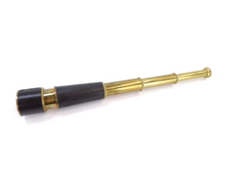 A 20thC brass three draw telescope, with brown leather cap ends and brass body, 37cm long. 