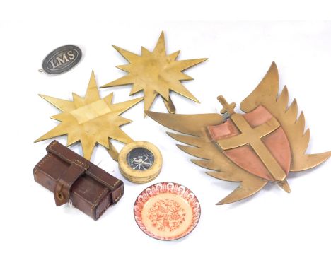 A collection of items, to include a trench art plaque, trench art crest, pair of similar star shaped ornaments, brass compass