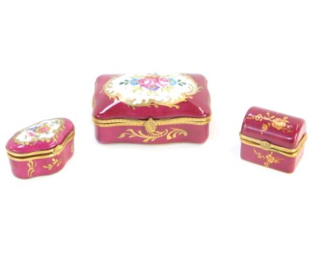 Three Limoges porcelain lidded jars, comprising a large rectangular example on pink ground with transfer printed flowers, 11c