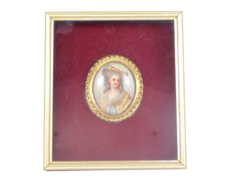 A framed porcelain portrait miniature, of a female with grey flowing hair in a yellow and rose detailed dress, in a gilt port