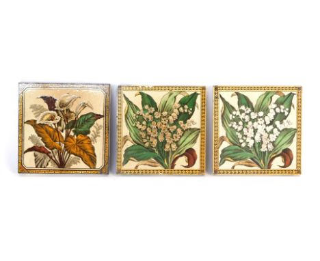 Three Mintons Victorian ceramic tiles, each with a yellow border and central floral spray, 15cm x 15cm. 