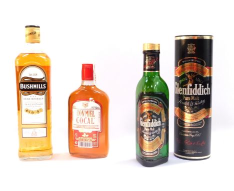 A 35cl bottle of Glenfiddich Pure Malt Scotch Whisky, boxed, a 75cl bottle of Bushmills Irish Whiskey 1608, and a 50cl bottle
