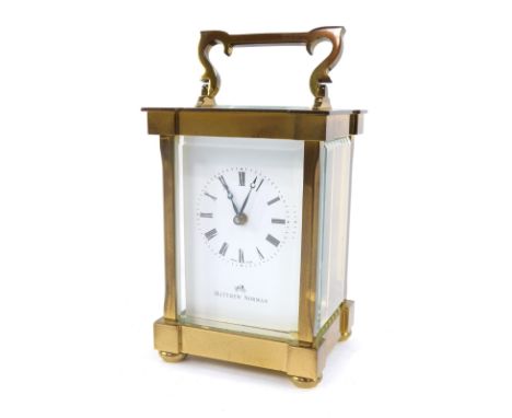 A Matthew Norman brass carriage clock, with white Roman numeric dial and retailer stamped Matthew Norman, the movement number