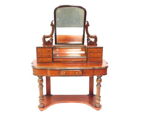 A Victorian mahogany Duchess dressing table, the shaped top with single drawer and shelf base, with a top section with one lo