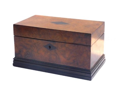 A Victorian burr walnut and rosewood inlaid tea caddy, of twin division rectangular form, raised on the plinth base, 14cm hig