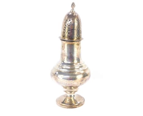 An Edward VII silver sugar shaker, the pierced and scroll top with fleur de lis finial, on bulbous stem body, on a stepped fo