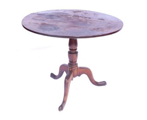 A 19thC oak tilt top table, on tripod base, 74cm high, 85cm diameter. 