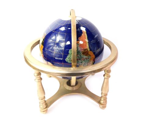 A table top semi precious stone spinning globe, on a blue ground with gold rings, spinning on square axis, 32cm high, 32cm wi