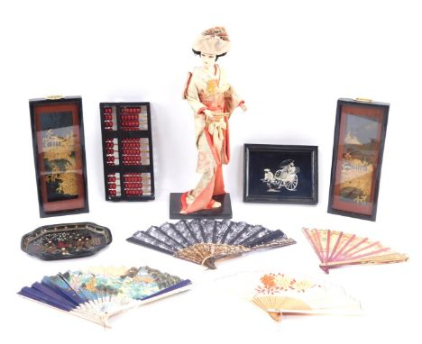 Oriental wares, comprising a blackened abacus, mother of pearl inlaid tray, four fans, two cork displays, and a figure of a g